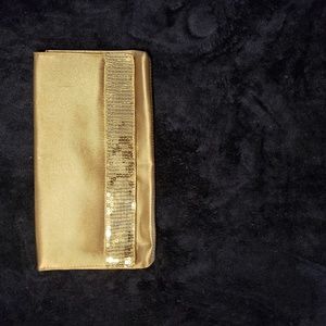 Skinny gold clutch